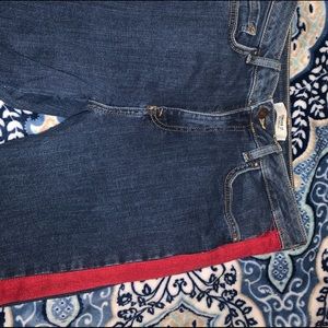 Dark wash jeans with red stripes on sides